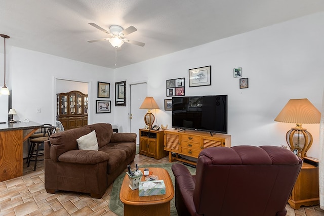 living room featuring ceiling fan