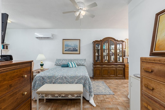 bedroom featuring ceiling fan and a wall unit AC