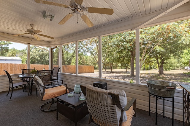 sunroom / solarium with ceiling fan and wood ceiling