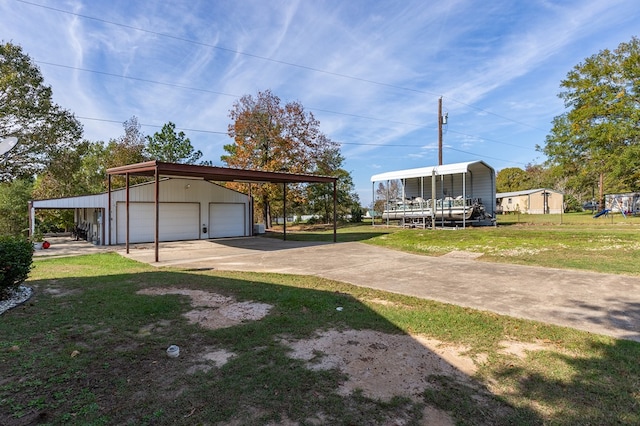 exterior space featuring an outbuilding, a garage, and a carport