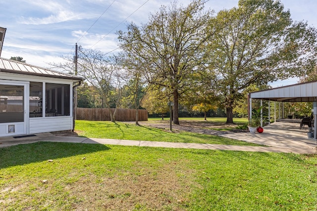 view of yard with a patio area and a sunroom