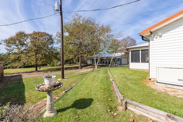 view of yard featuring a sunroom