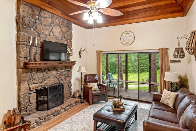 living area featuring a fireplace, wood finished floors, wooden ceiling, and a ceiling fan