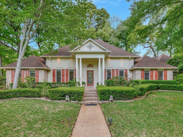 neoclassical / greek revival house with a front yard