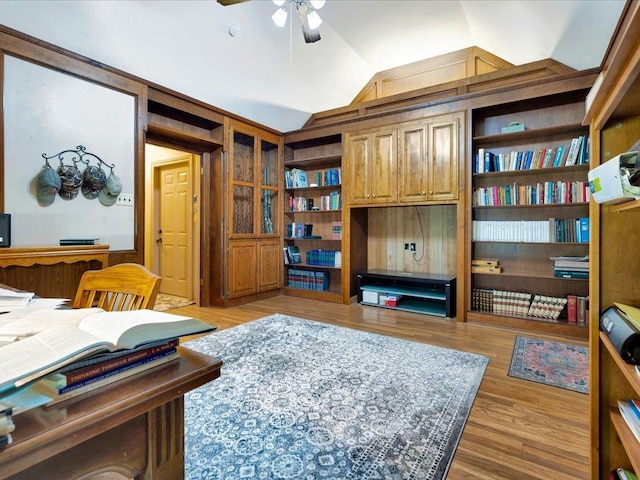 office area featuring ceiling fan, light hardwood / wood-style flooring, and vaulted ceiling