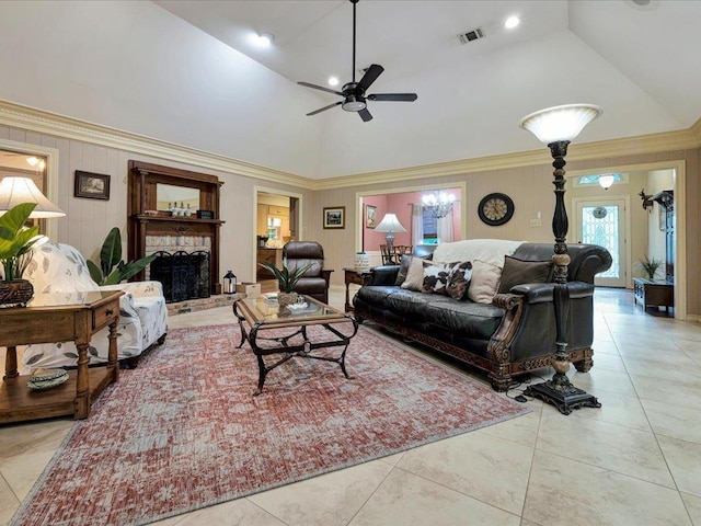 tiled living room with lofted ceiling, ceiling fan, and crown molding