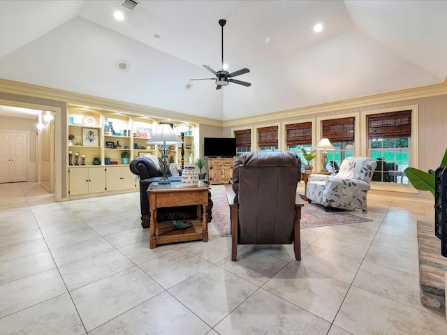 tiled living room featuring built in shelves, ceiling fan, and high vaulted ceiling