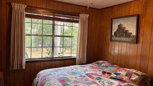 bedroom with wood walls