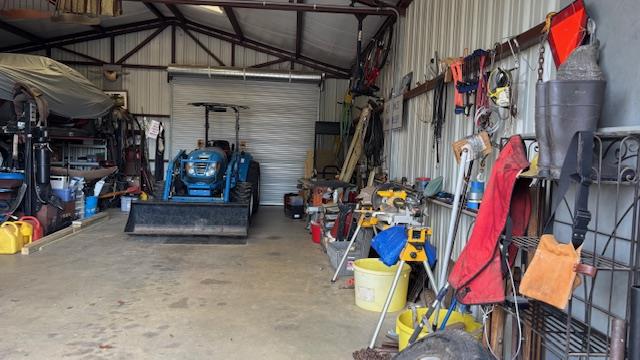 672 Oakhill Rd, Hemphill, TX 75948 - garage with metal wall