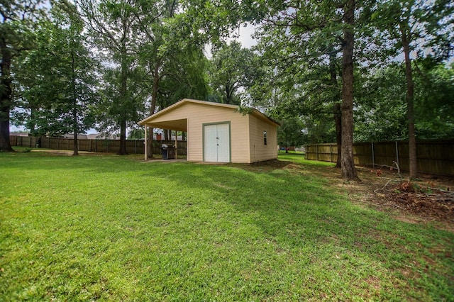 view of yard featuring a fenced backyard and an outdoor structure