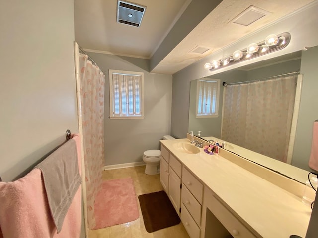 bathroom featuring tile patterned floors, toilet, vanity, and ornamental molding