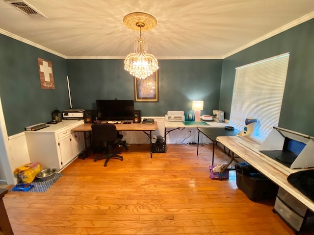 office area featuring light wood-type flooring, ornamental molding, and an inviting chandelier