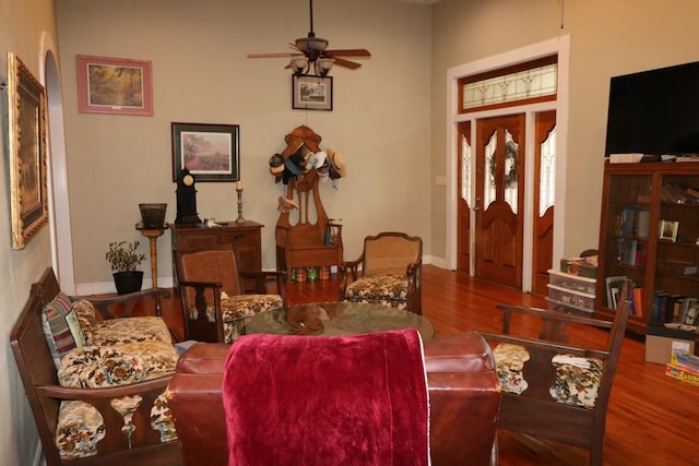 living room with ceiling fan and hardwood / wood-style floors