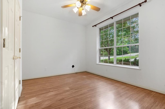 627 Shoreline Dr, Brookeland, TX 75931 - spare room with healthy amount of natural light, light wood finished floors, a ceiling fan, and baseboards