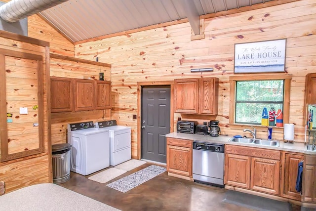 kitchen featuring stainless steel dishwasher, wood ceiling, sink, washing machine and clothes dryer, and wood walls