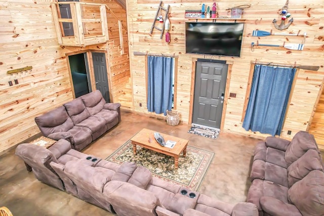 living room with wood walls