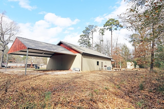 view of side of property featuring a carport