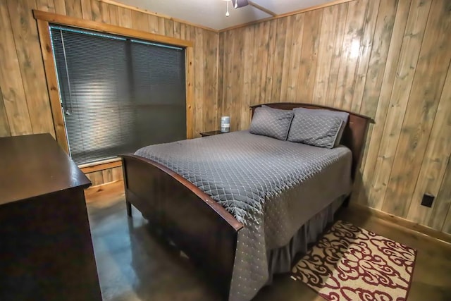 bedroom featuring wooden walls