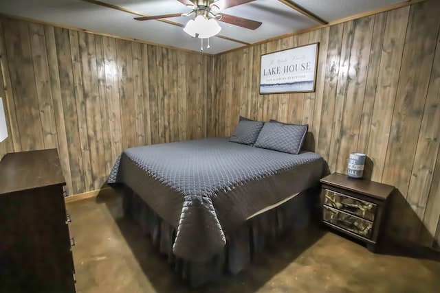 bedroom featuring ceiling fan and wooden walls