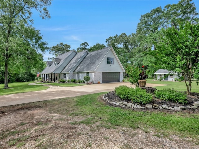3274 Cc Rd, Diboll, TX 75941 - view of home's exterior featuring driveway, a lawn, an attached garage, and brick siding