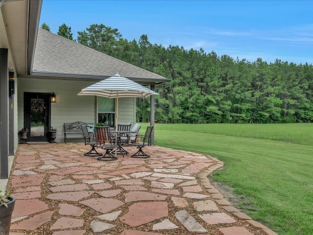 3274 Cc Rd, Diboll, TX 75941 - view of patio / terrace featuring a forest view and outdoor dining area