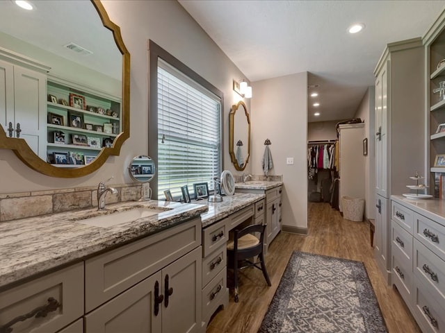 3274 Cc Rd, Diboll, TX 75941 - full bath featuring wood finished floors, a walk in closet, vanity, and recessed lighting