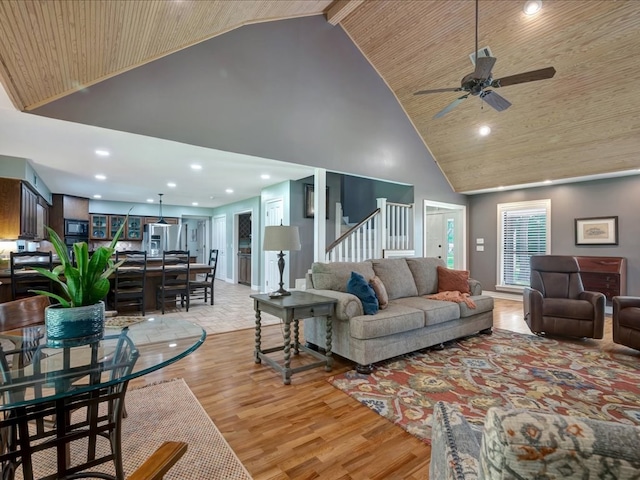 3274 Cc Rd, Diboll, TX 75941 - living room featuring high vaulted ceiling, light wood-type flooring, wooden ceiling, a ceiling fan, and stairs