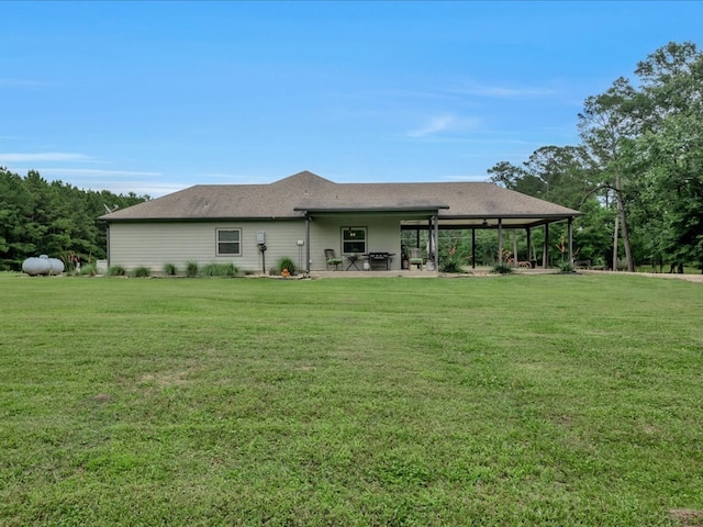 3274 Cc Rd, Diboll, TX 75941 - rear view of house featuring a lawn and a patio area