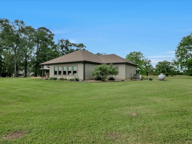 3274 Cc Rd, Diboll, TX 75941 - view of property exterior featuring a lawn and roof with shingles