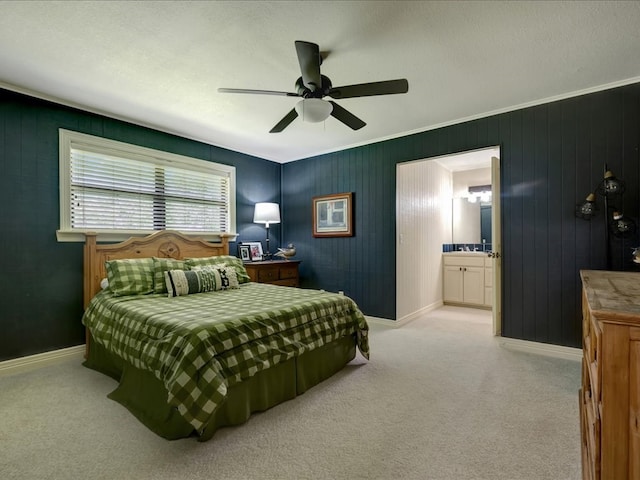 3274 Cc Rd, Diboll, TX 75941 - carpeted bedroom featuring baseboards, ceiling fan, and connected bathroom