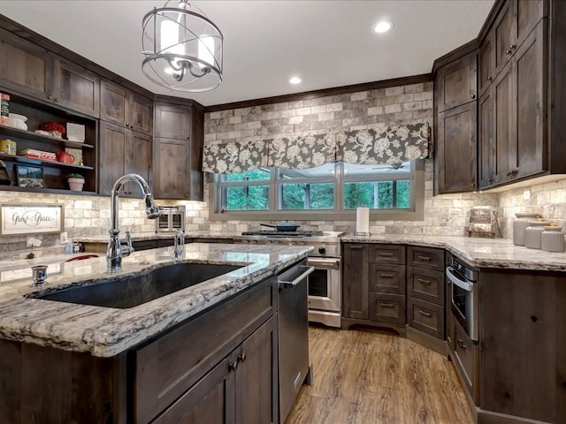 3274 Cc Rd, Diboll, TX 75941 - kitchen featuring a sink, dark brown cabinetry, tasteful backsplash, ornamental molding, and recessed lighting