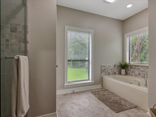 3274 Cc Rd, Diboll, TX 75941 - bathroom featuring a shower stall, a jetted tub, and baseboards