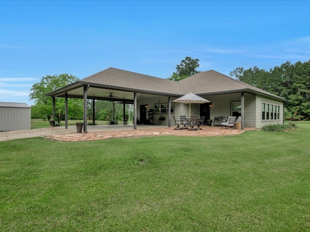 3274 Cc Rd, Diboll, TX 75941 - rear view of house featuring a patio, a lawn, ceiling fan, and roof with shingles