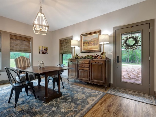 3274 Cc Rd, Diboll, TX 75941 - dining area featuring dark wood-style flooring, a chandelier, and baseboards