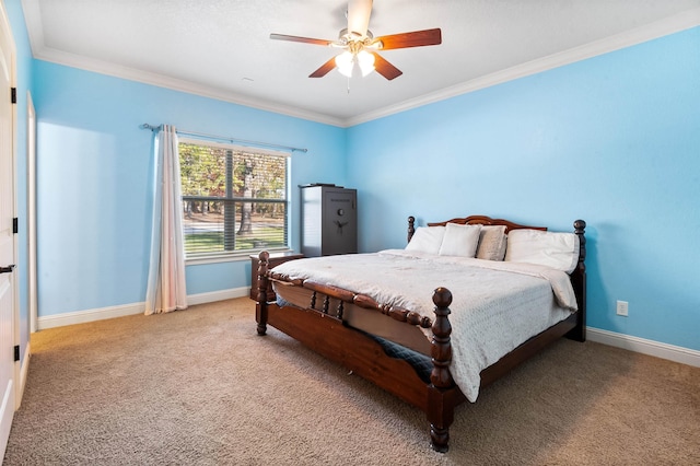 bedroom featuring ceiling fan, carpet floors, and ornamental molding