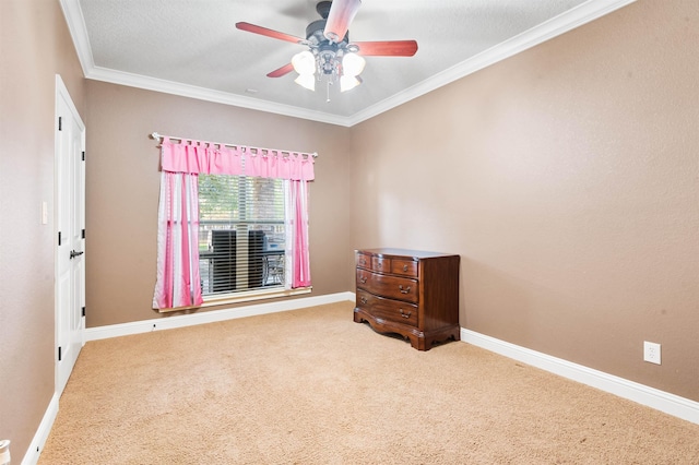 interior space featuring a textured ceiling, ceiling fan, and crown molding