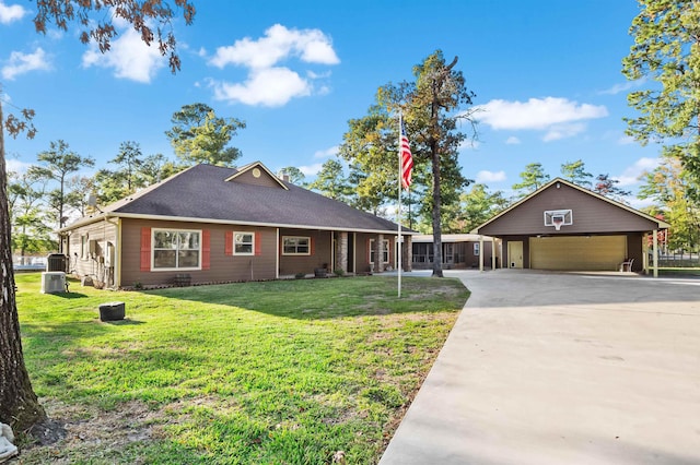 ranch-style house with a front yard, a garage, a carport, and an outdoor structure