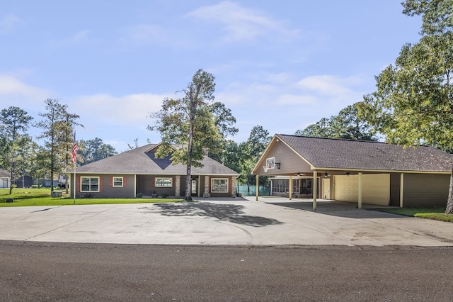 ranch-style home with a carport and a front yard