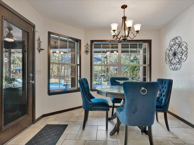 dining room with a notable chandelier