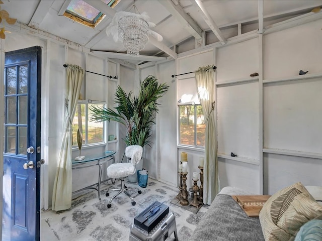 sitting room featuring lofted ceiling with beams and a chandelier