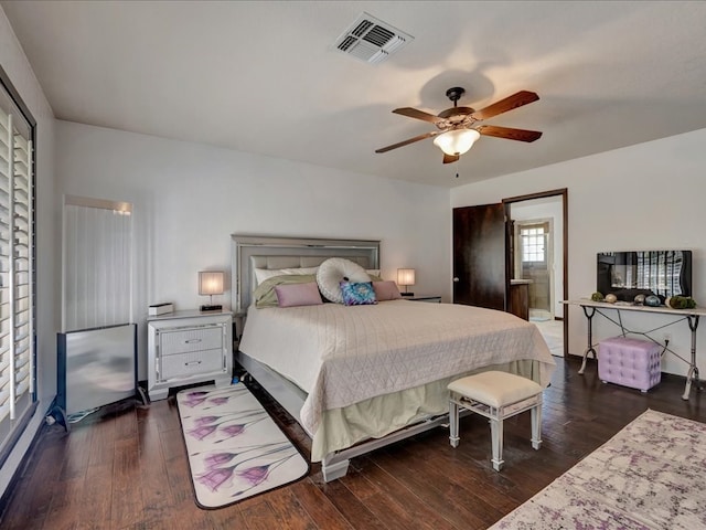 bedroom with visible vents, a ceiling fan, and wood finished floors