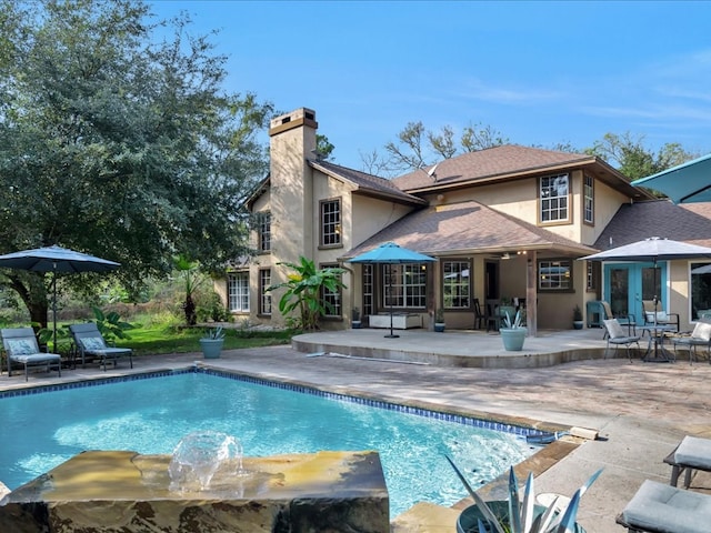 pool with a patio area