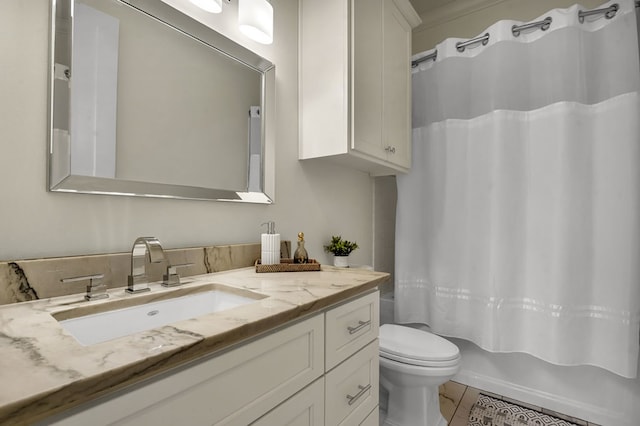 full bathroom with shower / bath combination with curtain, toilet, and vanity