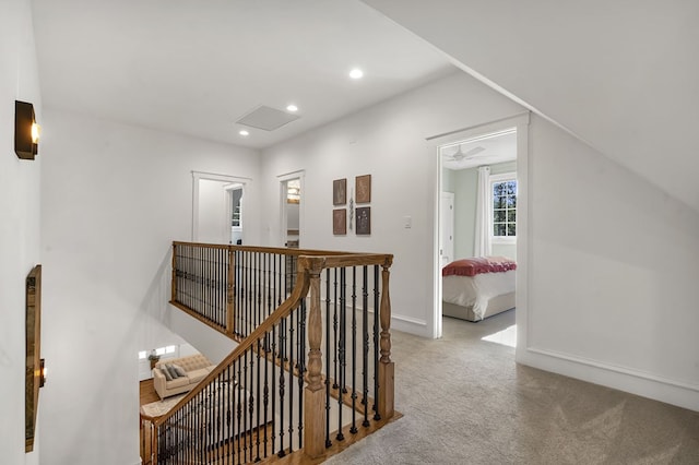 hall with recessed lighting, carpet flooring, an upstairs landing, and baseboards