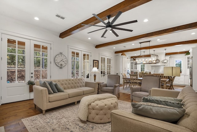 living room featuring visible vents, beam ceiling, hardwood / wood-style flooring, recessed lighting, and french doors