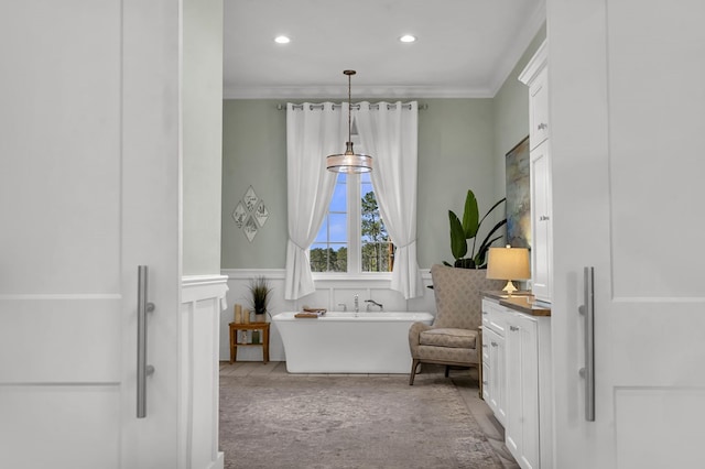 full bathroom featuring a wainscoted wall, recessed lighting, a freestanding bath, and crown molding