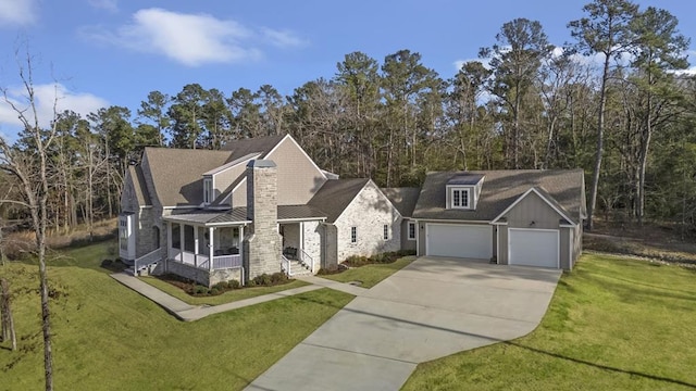 view of front of home with board and batten siding, a front yard, concrete driveway, and a garage