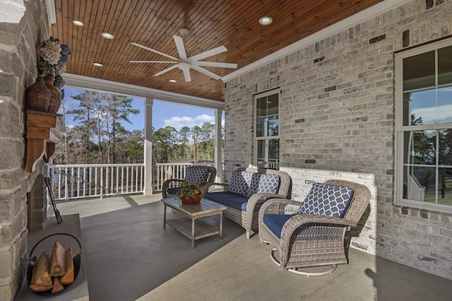 sunroom / solarium featuring wooden ceiling and ceiling fan