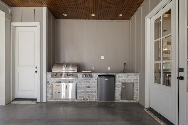 view of patio / terrace featuring a grill, exterior kitchen, and a sink