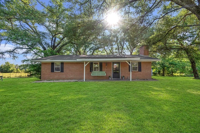 1328 Hyde Rd, Huntington, TX 74904 - ranch-style home with a chimney, a porch, and brick siding